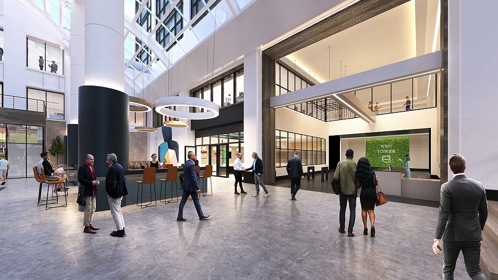 A group of people walking in a large building.